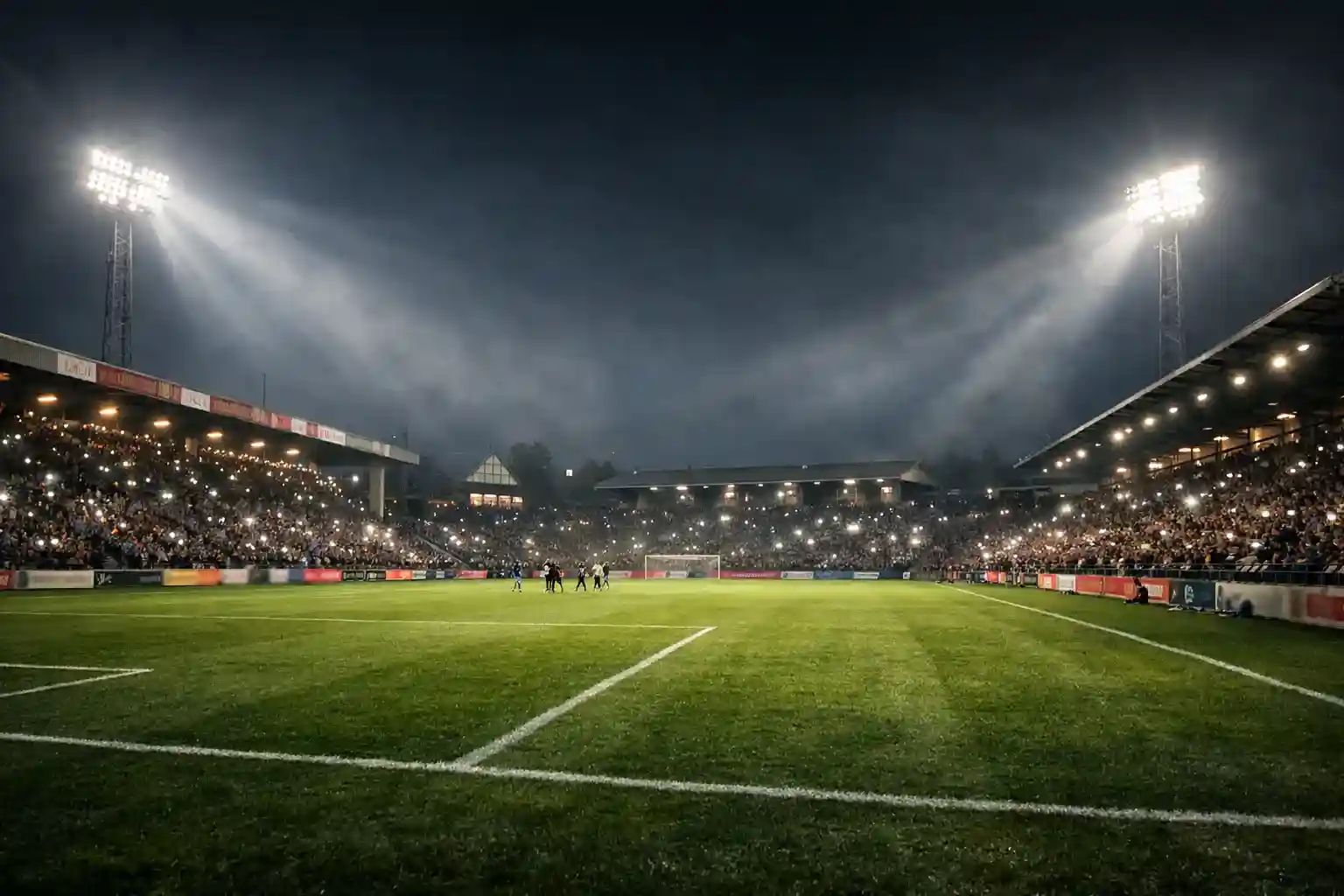 Stimmungsvolles Zweitliga-Stadion bei Flutlicht mit Fans auf den Rängen